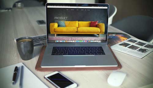 Laptop showing image of couch