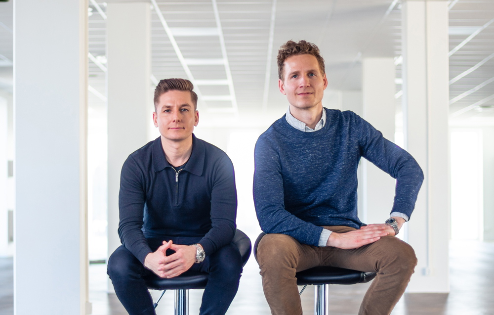 Two men sitting down